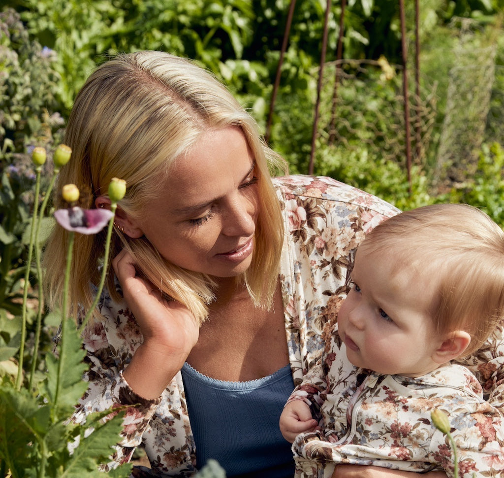 mother and child sitting together outdoors