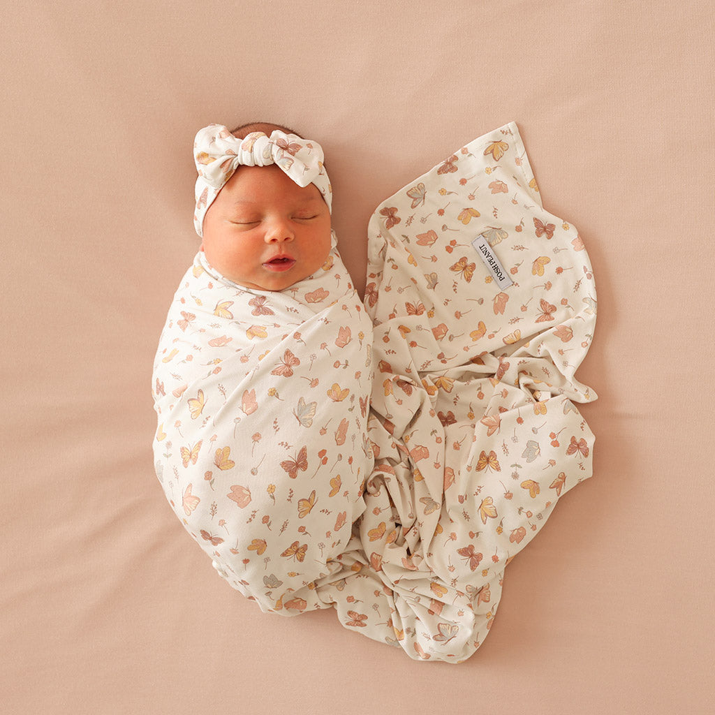 infant wrapped in swaddle