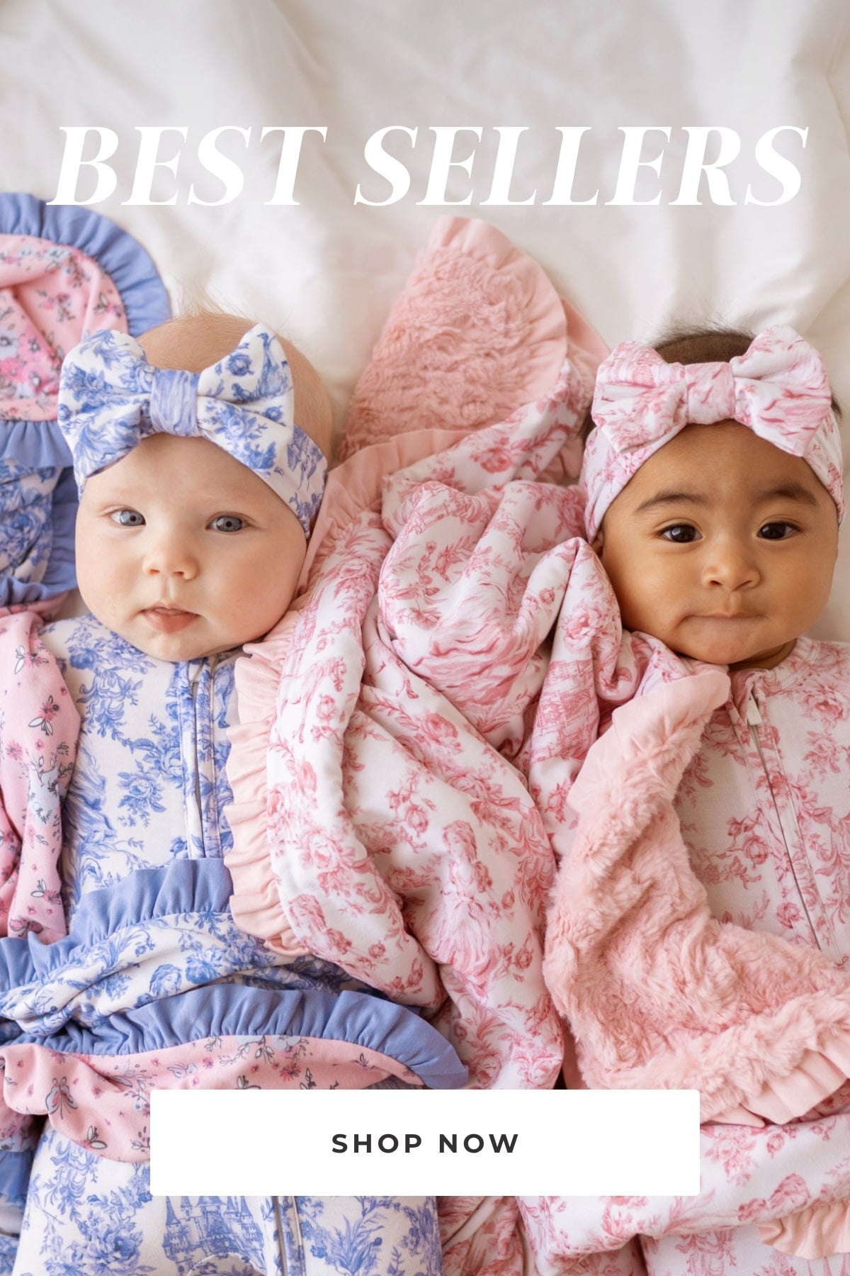 two infants wearing blue and pink floral themed print one piece bodysuits with matching blankets laying on bed with text 'Best Sellers Shop Now' 