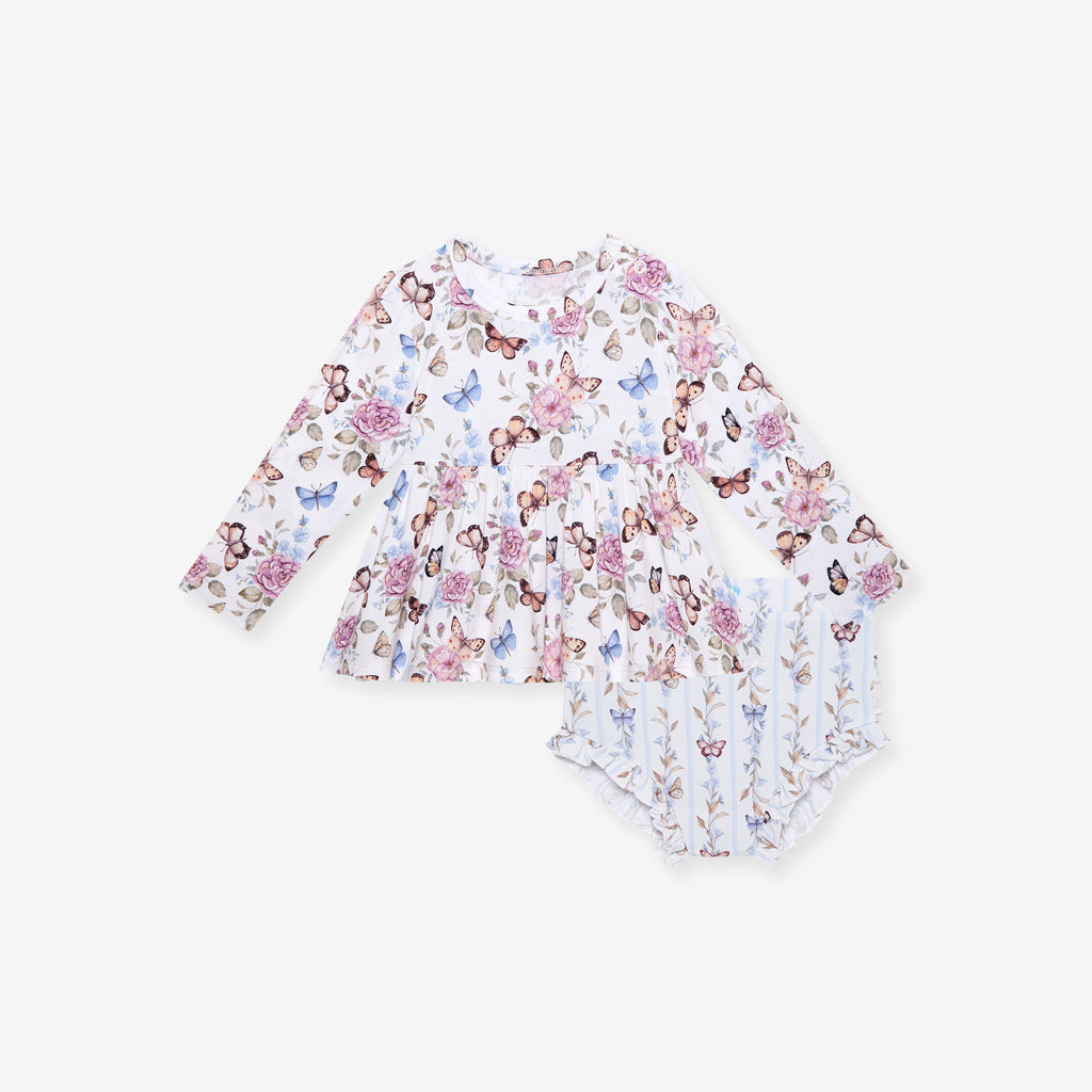 Floral and butterfly patterned baby bummie set on a white background