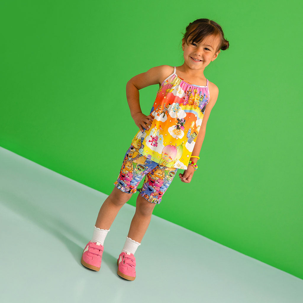 Child wearing Sesame Street printed tank and shorts set.