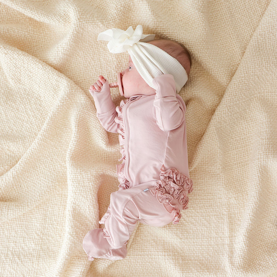 Delaney Blush Footie Ruffled Zippered One Piece