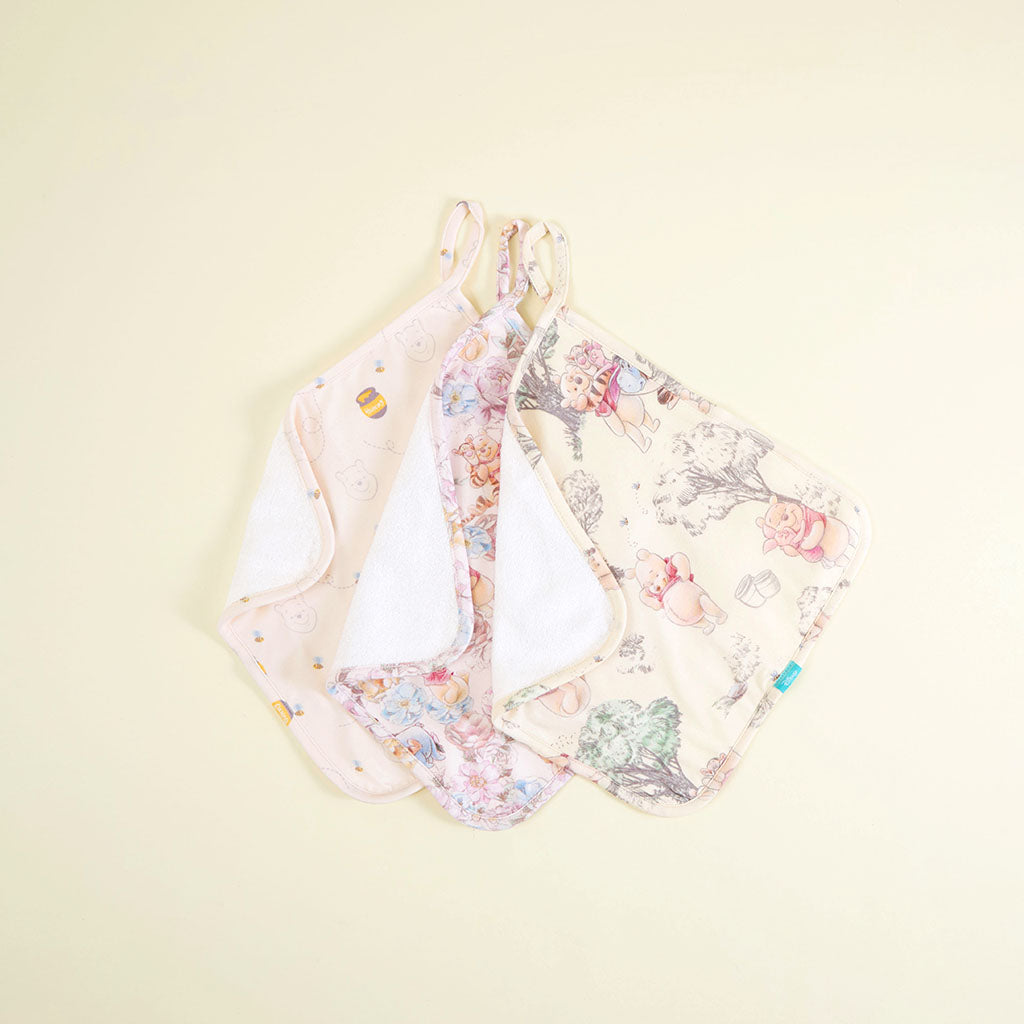 Set of floral-patterned baby washcloth sets on a light beige background