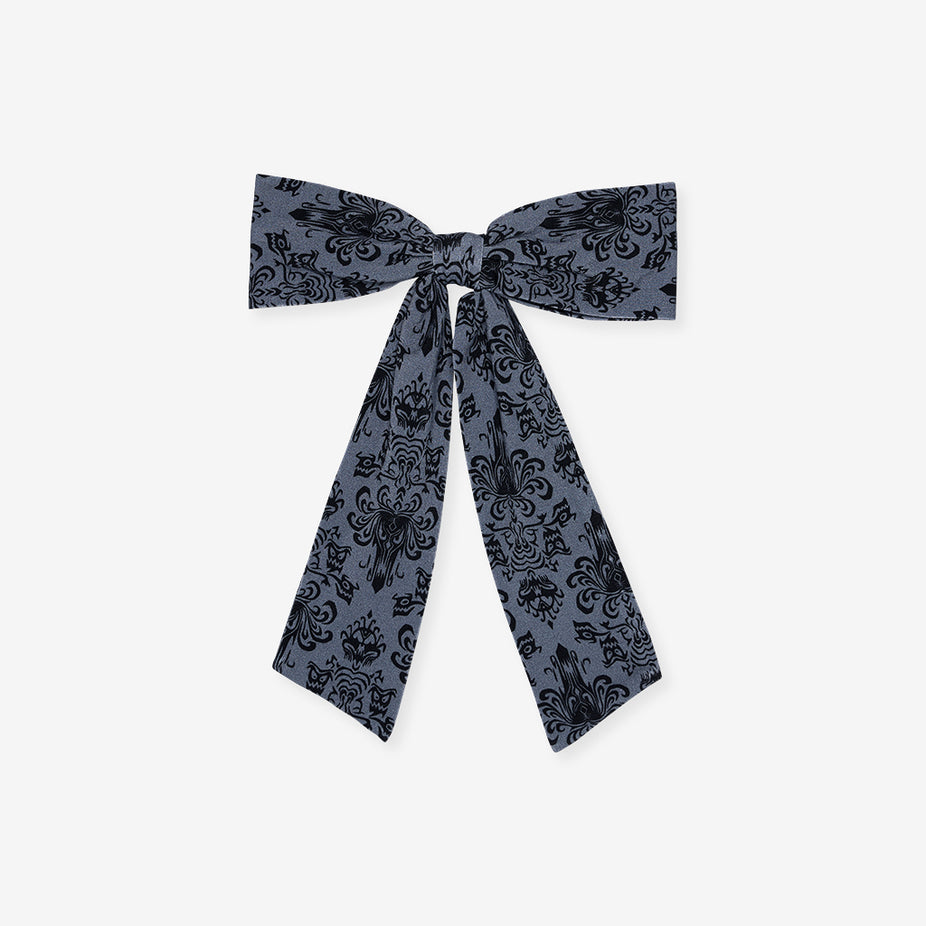 Posh Peanut Disney The Haunted Mansion Wallpaper Luxe Bow Hair Clip, front view, showing the bow in the dark damask-inspired print.