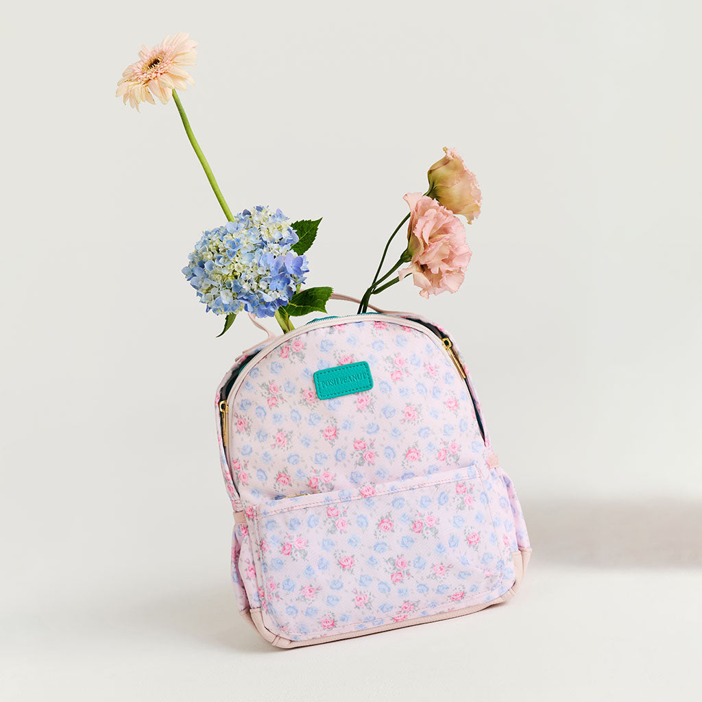 Floral-patterned backpack with flowers on a light background