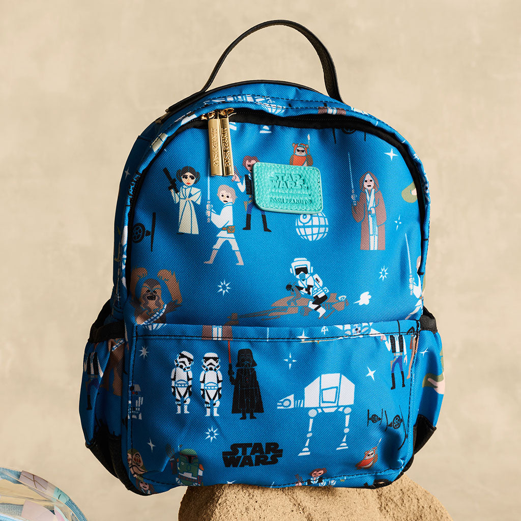 Blue backpack with Star Wars characters and teal posh peanut branding and gold zipper detail.