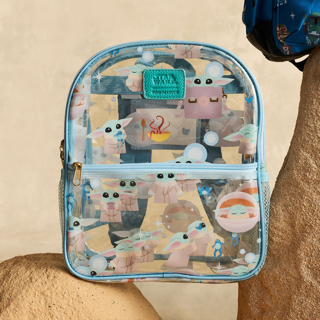 Clear backpack with Star Wars Grogu design on a beige background
