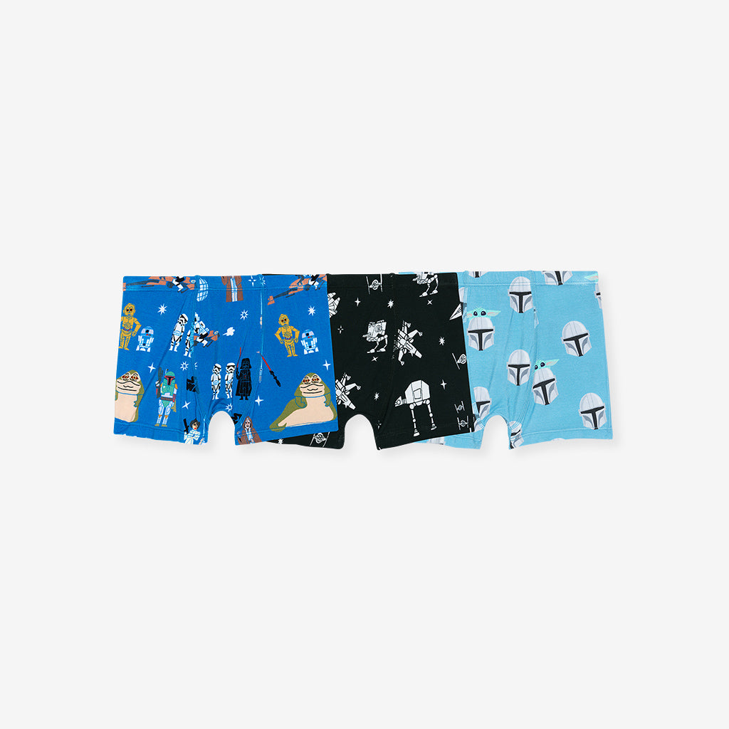 Three pairs of boxer briefs with different patterns on a white background
