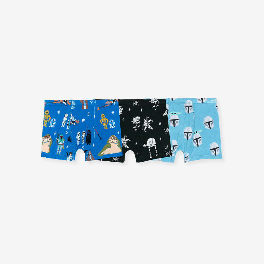 Three pairs of boxer briefs with different patterns on a white background