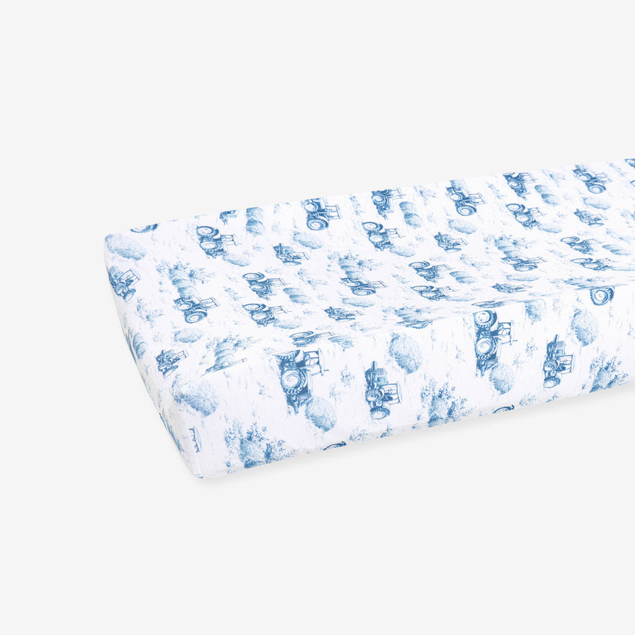 Fitted sheet with blue train pattern on a white background