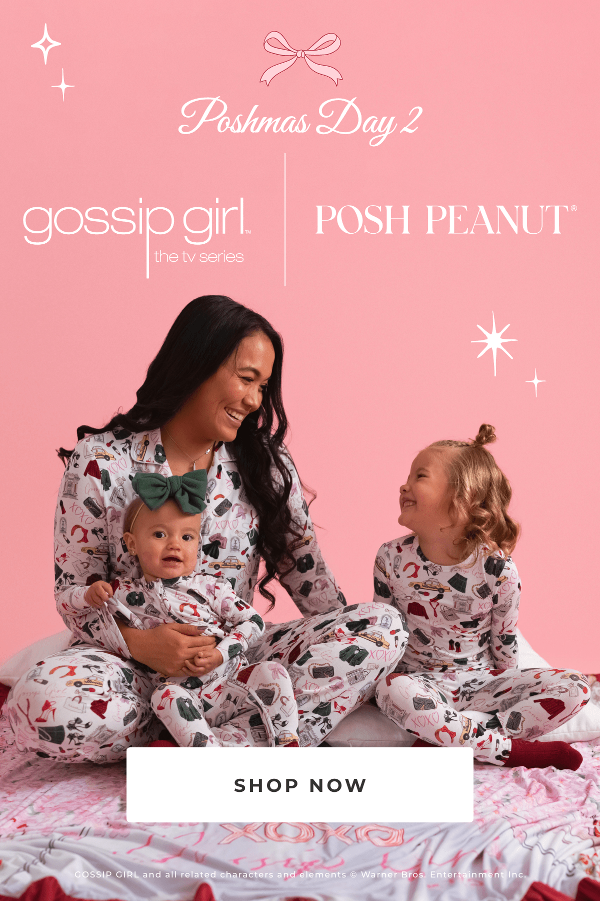 mother and two young children wearing matching Gossip Girl themed print pajamas with text 'Poshmas Day 2 gossip girl™ the tv series Posh Peanut® Shop Now GOSSIP GIRL and all related characters and elements © Warner Bros. Entertainment Inc.' on pink background