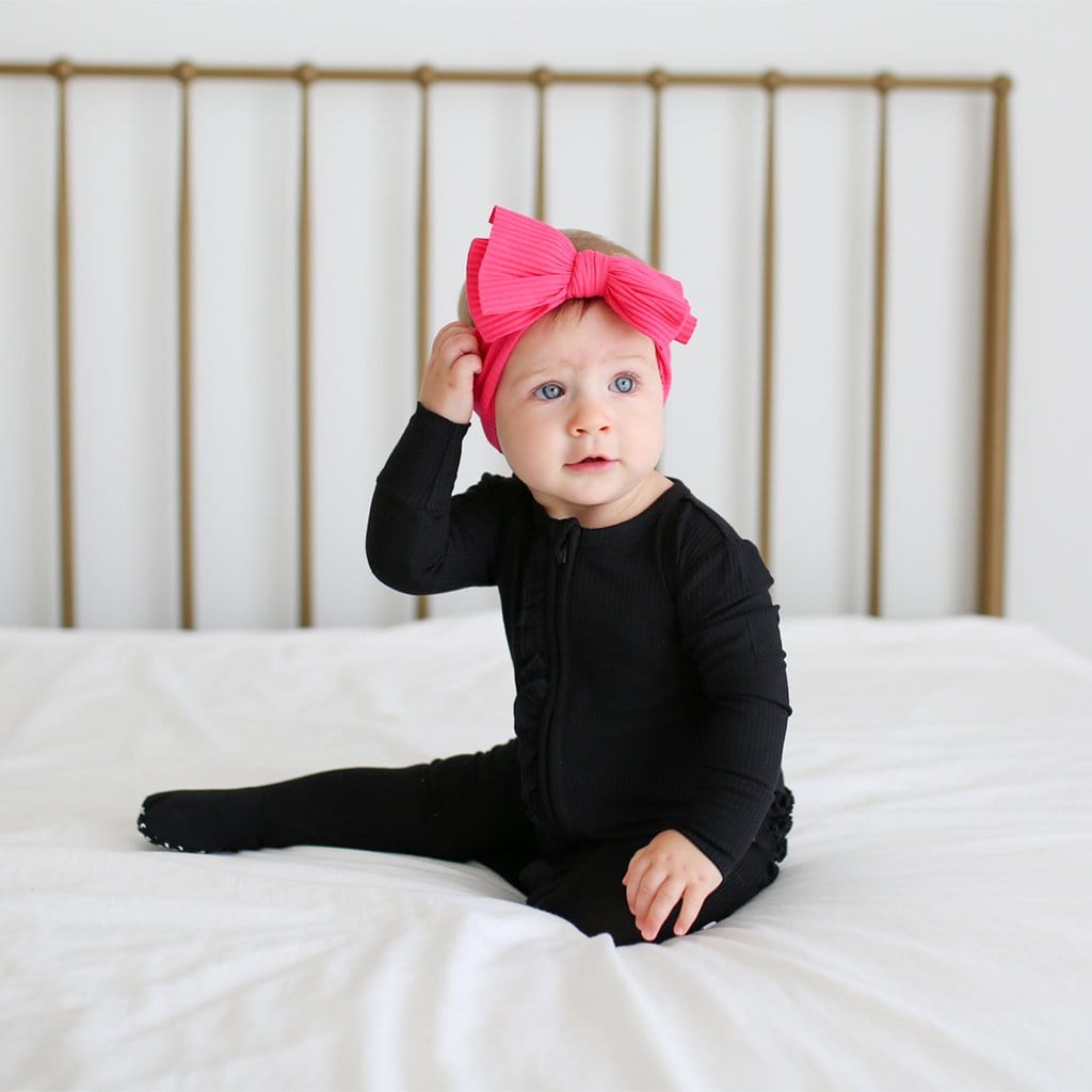 Baby on Black Ribbed Footie Ruffled Zippered One Piece with Pink Headband