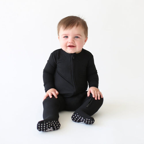 Baby wearing Black Ribbed Footie Zippered One Piece